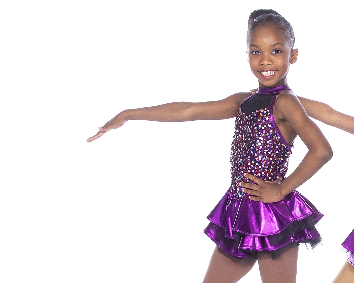 Peyton smiling in a sparkly purple dance costume